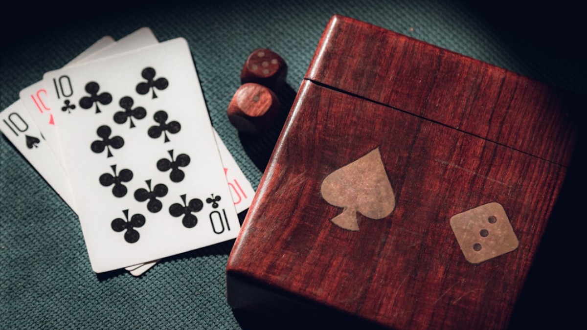 playing cards and dice on a table