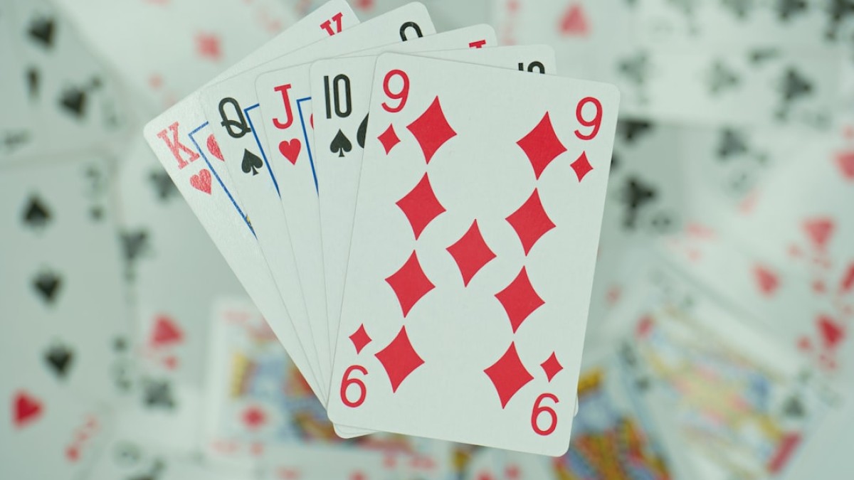 four of a kind of playing cards on a table