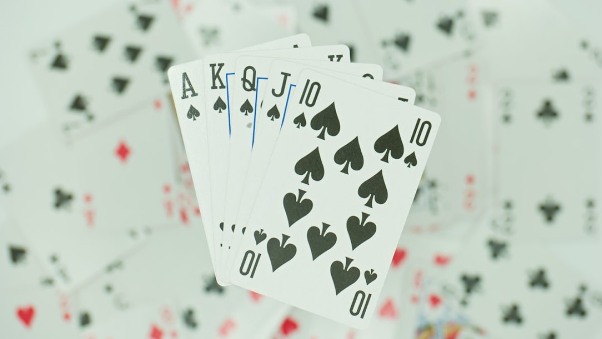 four of a kind of playing cards on a table